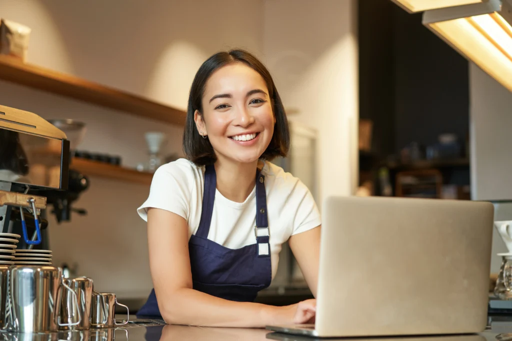 Confident small business owner after fixing why small business websites fail