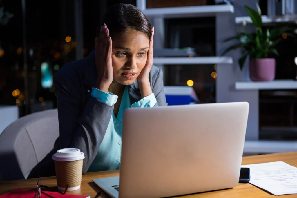 Frustrated business owner looking at a screen wondering why small business websites fail