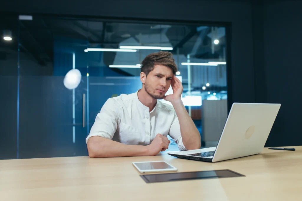 Frustrated small business owner struggling with free website builders
