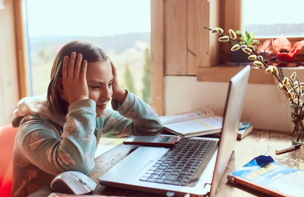 User looking frustrated while navigating a confusing website layout