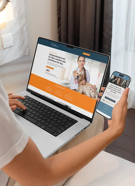 Person viewing veterinary clinic landing page on laptop and salon landing page on mobile phone during landing page services presentation